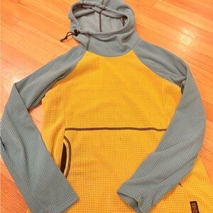 Melanzana Blue and Yellow Hooded sweater top with front open pocket as pictured.